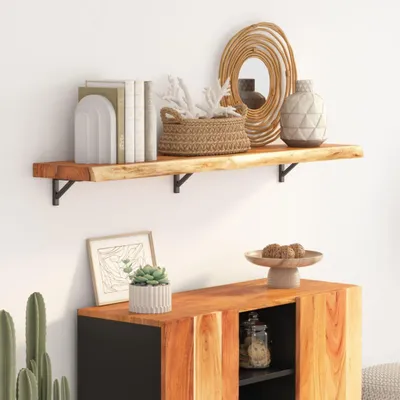 A wooden shelf with decorative items and a cabinet below, showcasing a home decor arrangement.