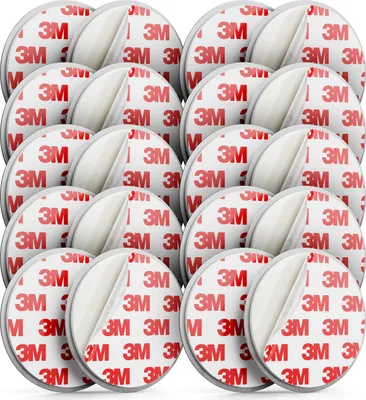 A pile of round adhesive pads with the 3M logo.