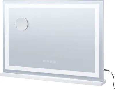 A white illuminated cosmetic mirror with a silver magnifying circle on a white shelf.