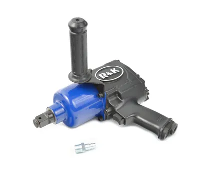 A professional studio shot of an air impact wrench and a pneumatic fitting on a white background.