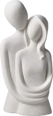 A white ceramic figurine of a couple embracing.