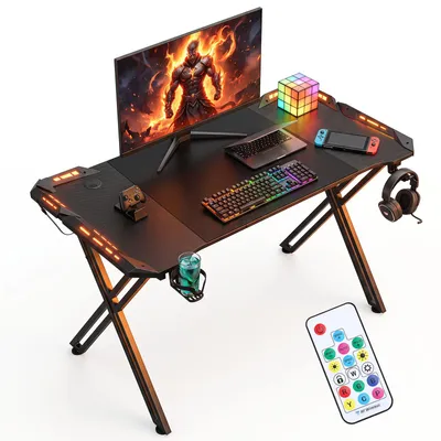 Image de Table de jeu Peviasot, dimensions 120x60 cm, design en forme de X, avec éclairage RGB LED, porte-gobelets et support pour casque