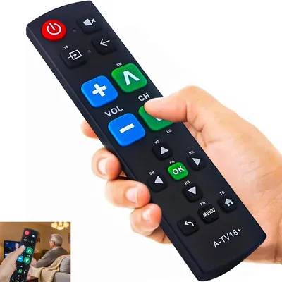 A hand holding a universal remote control.