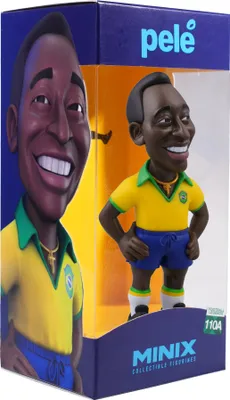 A collectible figurine of Pelé in its packaging.