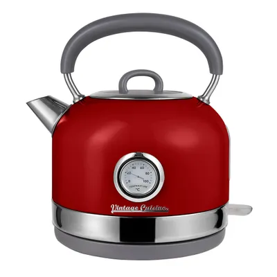 A red electric kettle with a thermometer on a white background.
