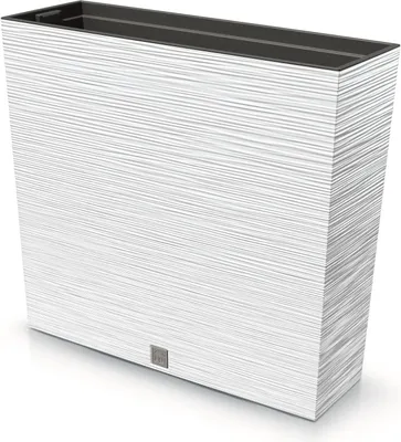 A white planter with a textured surface and a dark interior.