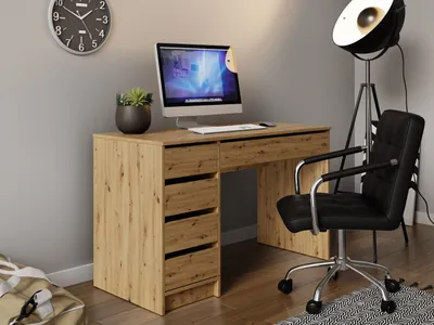 A home office setup with a desk, computer, chair, and lamp.