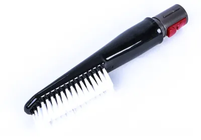 A close-up studio shot of a vacuum cleaner brush attachment against a white background.