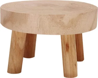 A small wooden stool or plant stand with three legs.
