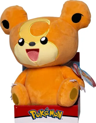 A plush toy of the Pokemon character Teddiursa sitting in its packaging.