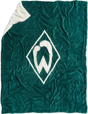 A folded green blanket with a white logo.