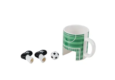 A soccer-themed mug with two soccer cleats and a soccer ball on a white background.