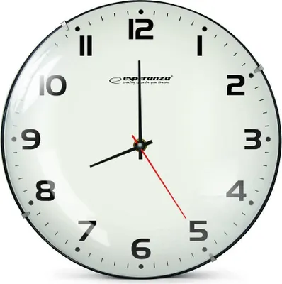 A close-up, front-facing view of a white analog wall clock with black numbers and hands.