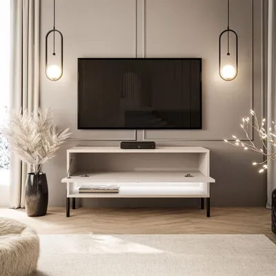 A modern living room setup with a TV stand and television.