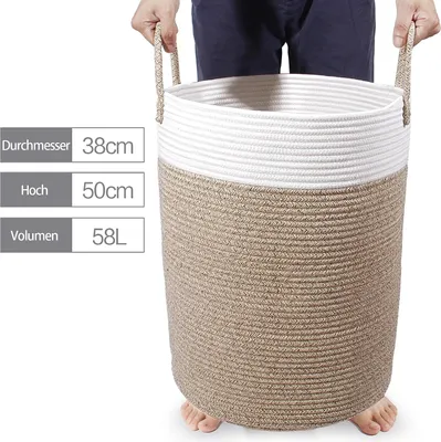 A person is holding a large woven basket.