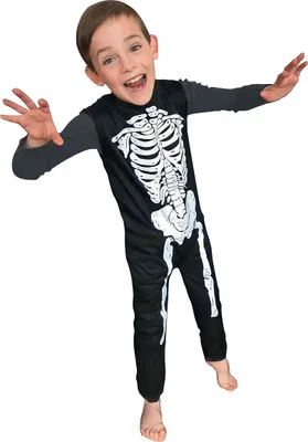 A young boy wearing a skeleton costume is posing for the camera.