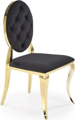 A studio shot of a black and gold chair.
