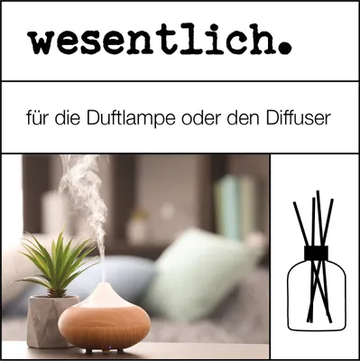A diffuser emitting steam next to a potted plant, with a graphic of a reed diffuser on the side.