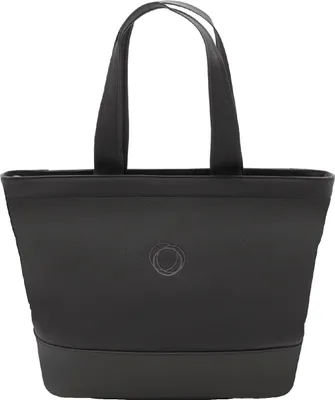 A black tote bag with two handles and a subtle circular logo on the front.