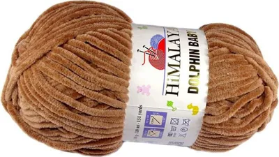 A ball of brown yarn with a label.