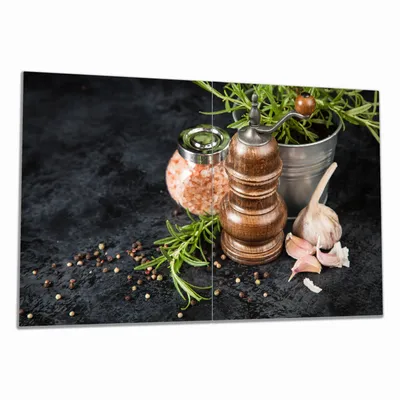 Produktbild von Wallario Herdabdeckplatte aus Glas, Größe 80 x 52 cm 2-teilig, Motiv Salz und Pfeffer mit Knoblauch und Rosmarin