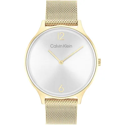 A close-up studio shot of a gold Calvin Klein watch with a silver dial.