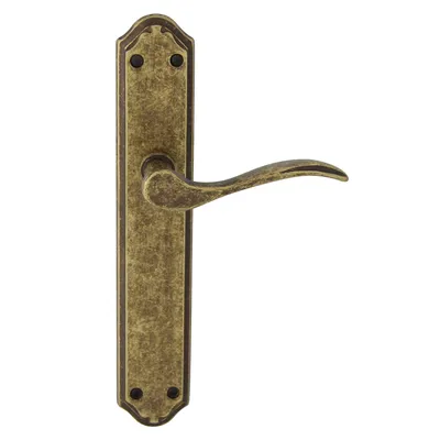 A single antique gold door handle with a long plate, shown against a white background.