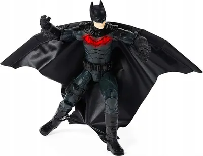 A Batman action figure with a wingsuit is posed in a dynamic stance against a white background.
