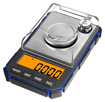 A close-up shot of a small digital scale on a white background.