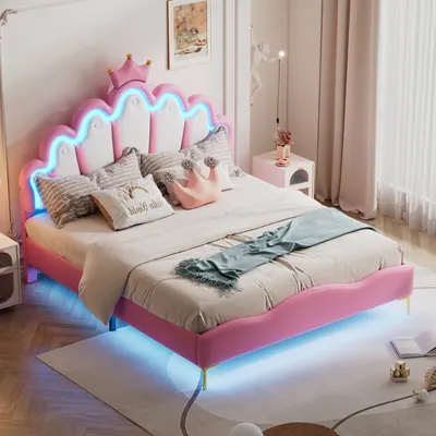 A pink princess-style bed with a crown-shaped headboard and LED lighting is shown in a bedroom setting.