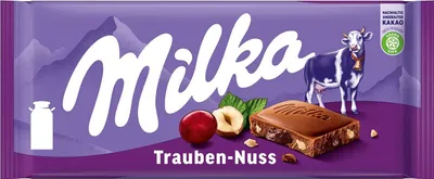 Zdjęcie produktu dla Milka Czekolada Mleczna Z Rodzynkami I Orzechami Laskowymi 100 G
