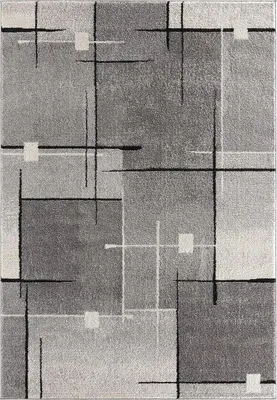 A flat lay image of a rug with an abstract geometric design.