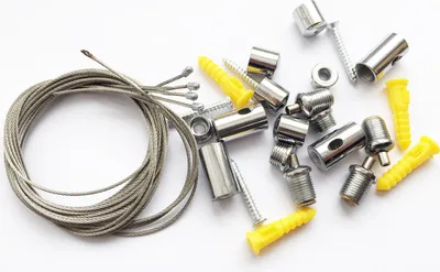 A collection of metal mounting hardware for LED panels, including cables, screws, and anchors, laid out on a white background.