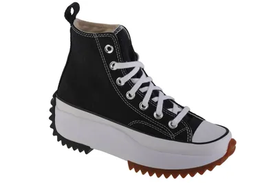 A black Converse Run Star Hike Hi sneaker with a white platform sole and a brown rubber sole.