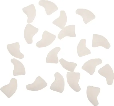 A collection of pet claw caps scattered on a white background.