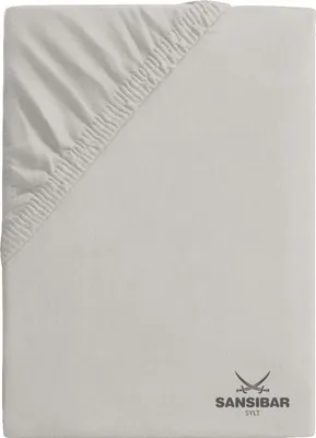 A folded fitted sheet with elastic corners.