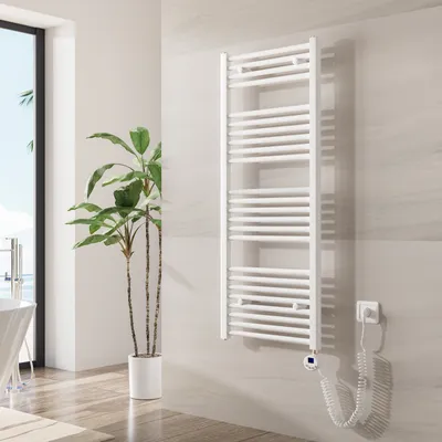 A white electric towel radiator mounted on a tiled wall in a modern bathroom.