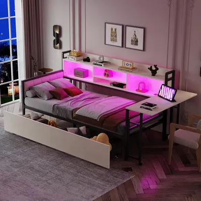 A bedroom setting with a bed, desk, and storage.