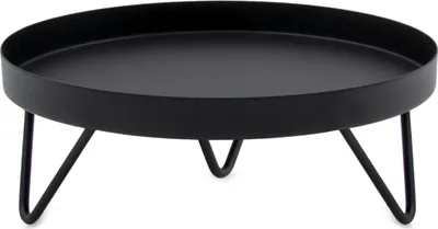 A black metal plant stand with three legs.