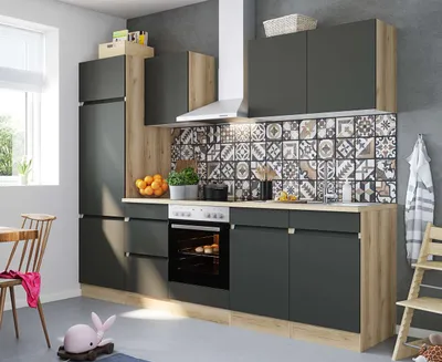 A modern kitchen setup with dark gray cabinets and a wood-grain accent.