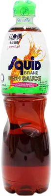 A bottle of Squid Brand Fish Sauce against a white background.