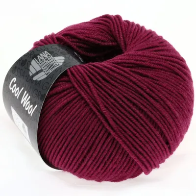 A ball of burgundy yarn with a label wrapped around it.