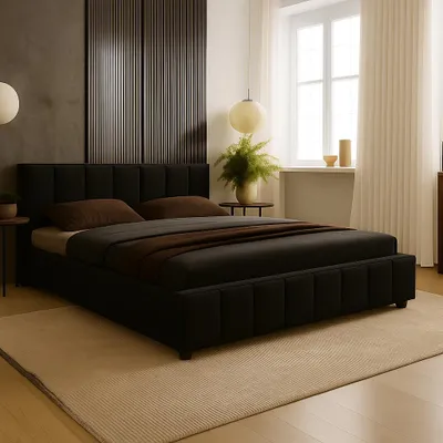 A bedroom scene with a black bed as the focal point, styled with pillows and a throw blanket. The room features a large window with sheer curtains, a plant, and decorative wall paneling.