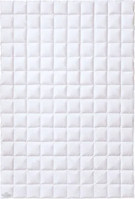 A white quilted blanket or duvet laid flat, showing a grid pattern of squares.