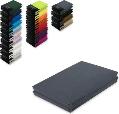 Stacks of colorful folded fabric items and a folded dark grey fabric item.