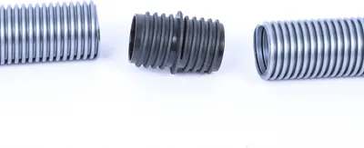 Three pieces of flexible tubing and a connector are laid out on a white background.