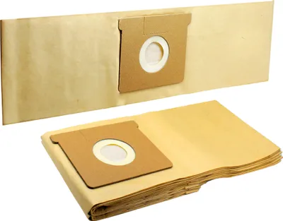 A stack of brown paper vacuum cleaner bags in the foreground, with another bag attached to a larger piece of brown paper in the background.