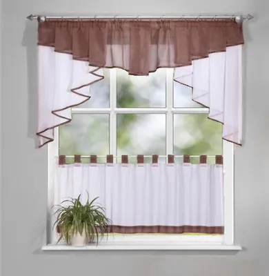 A window with curtains and a plant on the windowsill.