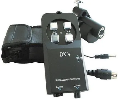 A black electronic device with buttons and cables, along with a black fabric pouch, is displayed against a white background.