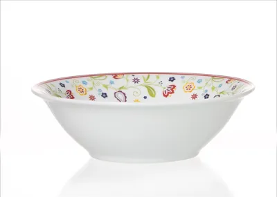 A white ceramic bowl with a floral pattern around the rim, set against a white background.